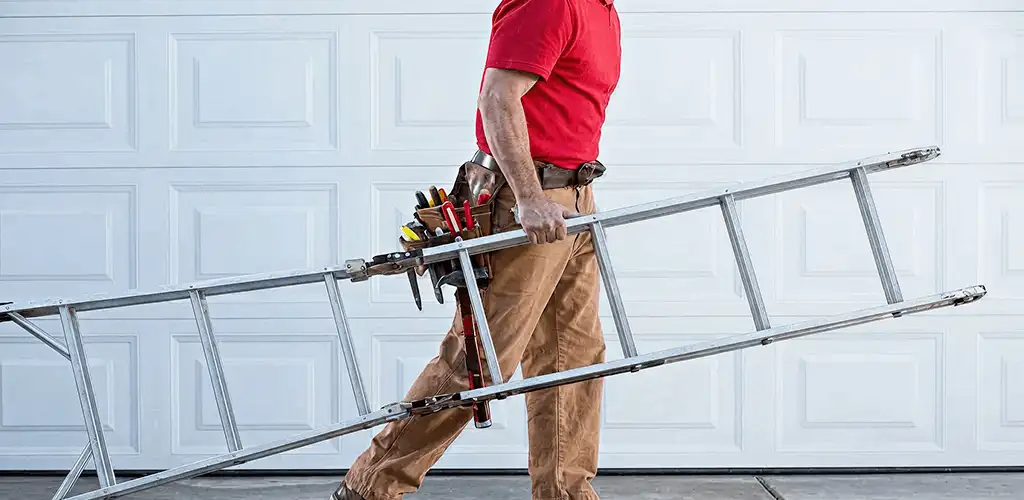 Garage door repair technician arriving with tools and ladder in Columbus, OH